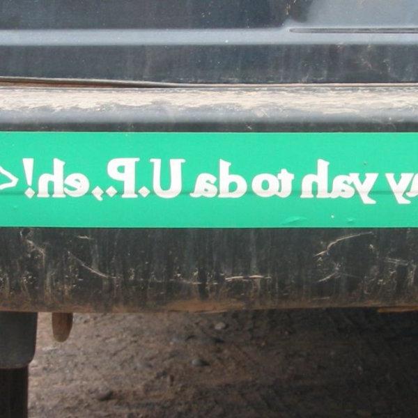 A green bumper sticker says, "Say yah to da U.P., eh!"